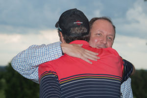 Randy Eggert embraces Paul Harari