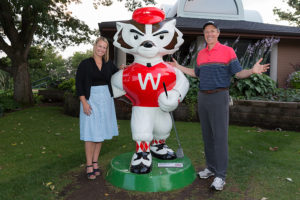 Jill Schmitz and Paul Harari with Bucky the Golfer