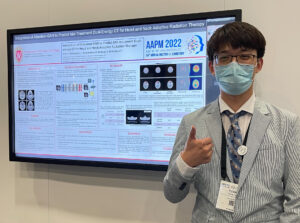 Picture of Yuhao next to his AAPM poster